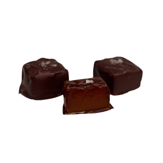 Three chocolate candies on a white background